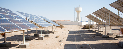 Solar panels and a water tower. Photo: Alex Derr