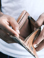 Man with an empty wallet. Image: Towfiqu Barbhuiya