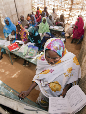 A view inside Abu Shouk Internally Displaced Persons (IDP) Camp&#039;s Women Center, in North Darfur, Sudan, where classes are offered in Arabic, the Koran and Mathematics. Approximately 80 women attend the classes, usually taking their children along with the